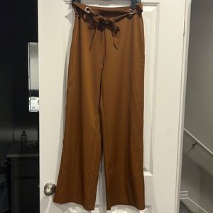 Brown 70s style pants with front tie and side zipper. Size small.